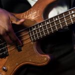 Black Male Politician and Associate Shaking Hands in front of Flashing Cameras